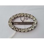 A rhinestone set oval buckle