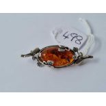 An attractive silver and amber brooch