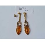 A pair of amber style ear pendants