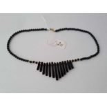 A stylish vintage black onyx necklace with 9ct spacer beads and clasp 17g inc