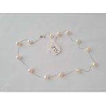 A WHITE GOLD AND MULTI PEARL BEAD NECKLET IN 14CT GOLD 16 INCHES