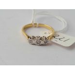 A three stone diamond illusion ring set in 18ct gold size R 2.9g inc