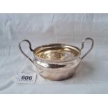 A sugar bowl with reeded rim and two loop handles 6 inches wide London 1938 - 107 gms