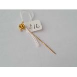 A sailors knot gold terminal stick pin in high carat