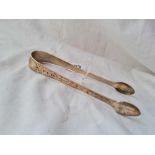 A pair of George III bright cut sugar tongs, London 1910.