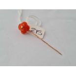 A coral rose head topped gold stick pin