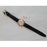 A MIDI SIZE LONGINES WRIST WATCH WITH SECONDS DIAL SET IN GOLD WITH BLACK LEATHER STRAP