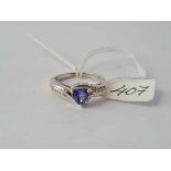 A Tanzanite set 9ct white gold ring with diamond shoulders size N 3.6g inc