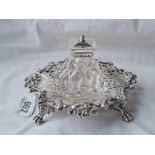 A good decorative Victorian ink stand with pierced and cast decoration and four claw feet 7 inches