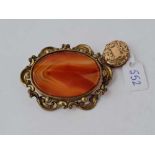 A rolled gold oval locket & large oval agate gilt brooch