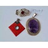 Two silver mounted pendants and a pretty silver brooch