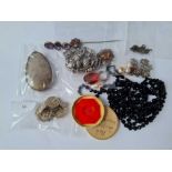 A mixed bag of assorted costume jewellery including French jet beaded necklace, Scottish stick