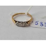 A three stone diamond ring 18ct gold size M