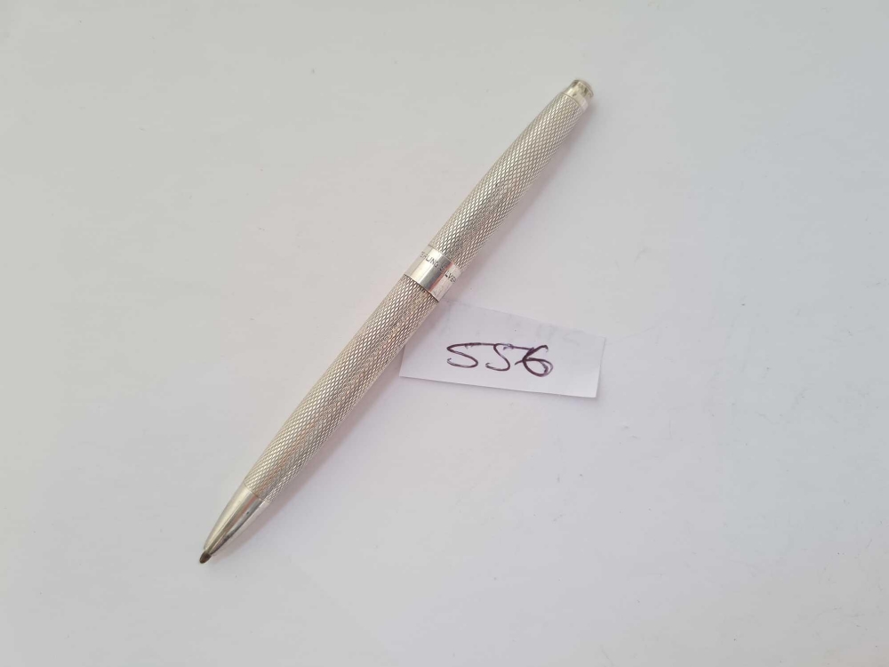 A sterling silver pencil