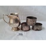 A baluster shaped mug & 3 napkin rings, w.157g