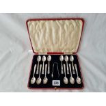 A boxed set of twelve art deco style coffee spoons and a pair of tongs Sheffield 1938 by CB&S