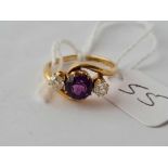 A diamond and amethyst cross over ring 18ct gold size J1/2 -3.2 gms