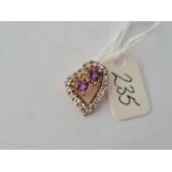 A small amethyst and white stone witches heart pendant in 9ct mount 1.9g inc