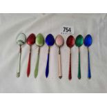 Eight various enamel decorated coffee spoons.
