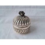 A foreign silver jar and cover fluted decoration flower finial 2 1/2 inches dia - 54 gms