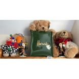 A shelf with Harrods & other bears