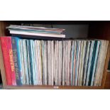 A shelf of numerous LP records