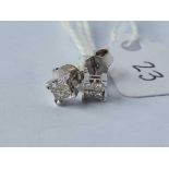A pair of white gold diamond earrings 9ct