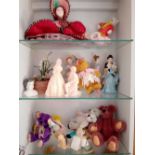 Three shelves of assorted miniature dolls, bears etc