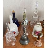 A collection of 9 glass china & metal hand bells