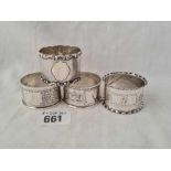 Four scroll engraved and other napkin rings - 1910, 1911 etc - 83 g.