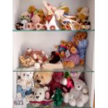 Three shelves of assorted miniature dolls, bears etc