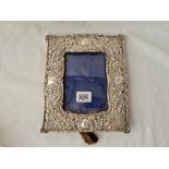 An Edwardian oblong photo frame, embossed with flames and scrolls - 8" high - Birmingham 1902 (