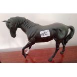 Black Beswick horse with white forehead