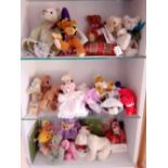 The bottom three shelves of assorted miniature dolls, bears etc