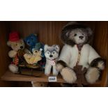 Five Steiff bears (on middle shelf)