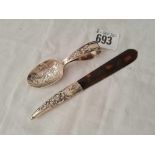 A mounted tortoise shell letter opener and a Hey, Diddle, Diddle childs spoon (damaged)