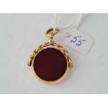 A good large hard stone spinning fob set with cornelian and onyx - 11 gms inc