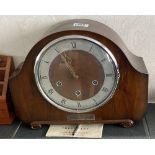 A deco style Westminster chiming mantle clock with key