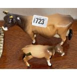 A Beswick model of a Jersey cow "Newton Tinkle" together with a calf