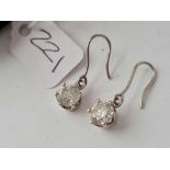 A EXCEPTIONAL PAIR OF PLATINUM DIAMOND EARRINGS EACH MEASURING OVER 1 CARAT