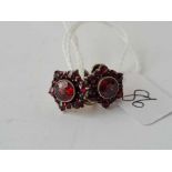 A pair of garnet screw back earrings