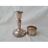 A candlestick with beaded rims - 4" high - Birmingham 1950 and a napkin ring