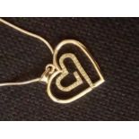 A large silver heart pendant set with diamonds on silver chain with certificate 6.3g inc