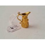 A heavy charm in the form of a ewer 9ct - 7.4 gms