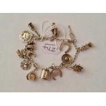 A vintage silver charm bracelet - 24.5 gms