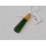 A gold and nephrite pendant