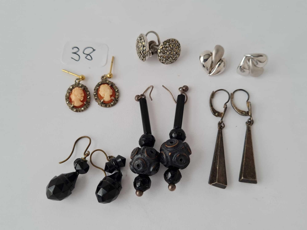 Four pairs of silver and other earrings