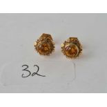 A pair of citrine and 9ct ear studs 1.6g inc