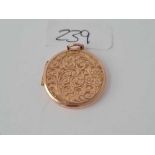 A circular gold back and front locket - 5.4 gms