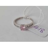 A white gold pink stone and CZ ring 9ct size N